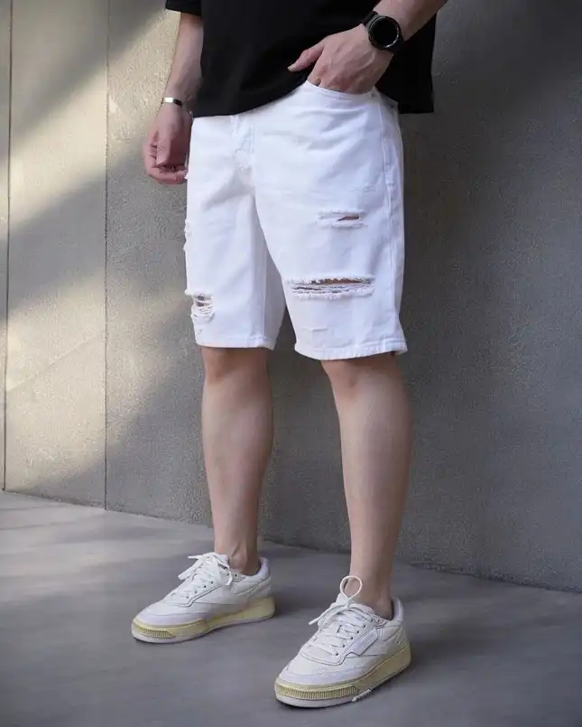 Distressed White Denim Shorts With a Black Tee