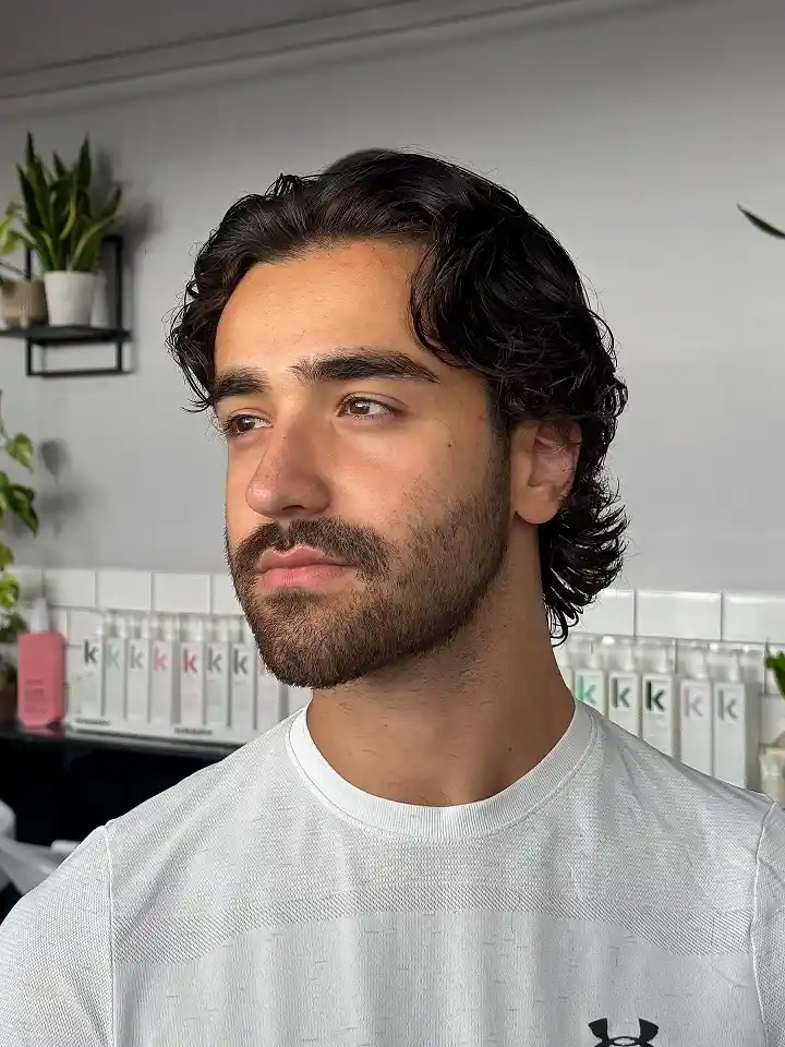 17 Classic Medium Length Mens Haircuts and Exactly What to Ask Your Barber 8 Natural Curl Kept Medium With a Soft Taper