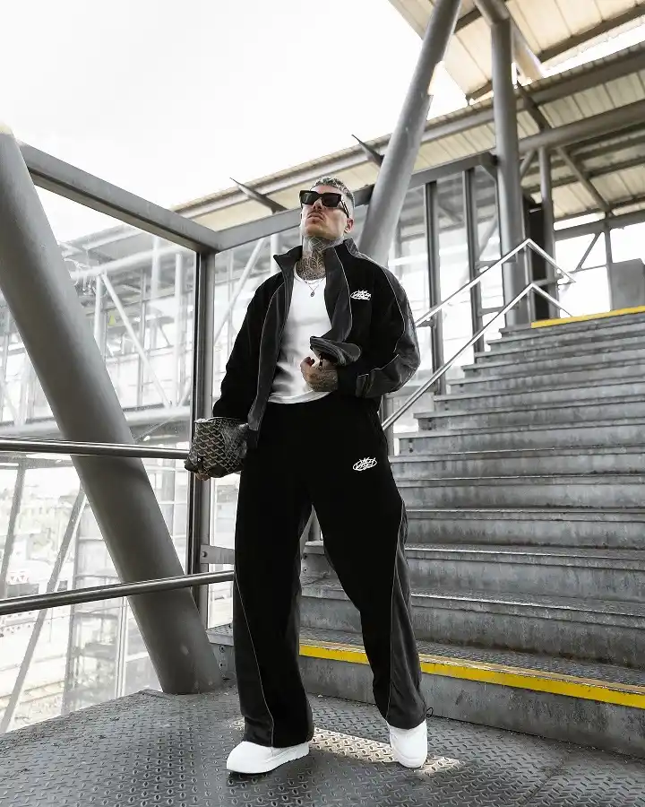 Black Velour Tracksuit With a White Tee Underneath