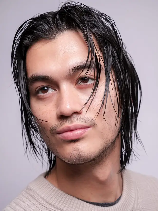 17 Classic Medium Length Mens Haircuts and Exactly What to Ask Your Barber 3 The Wet Finish Middle Part for Heavy, Straight Hair