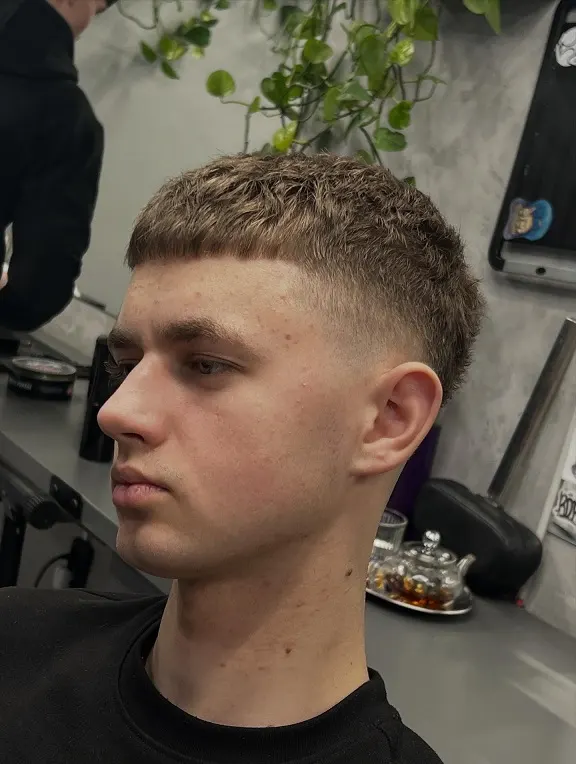 23 Trendy French Crop Hairstyles for Men to Try in 2026 11 Short Textured French Crop With a Skin Fade