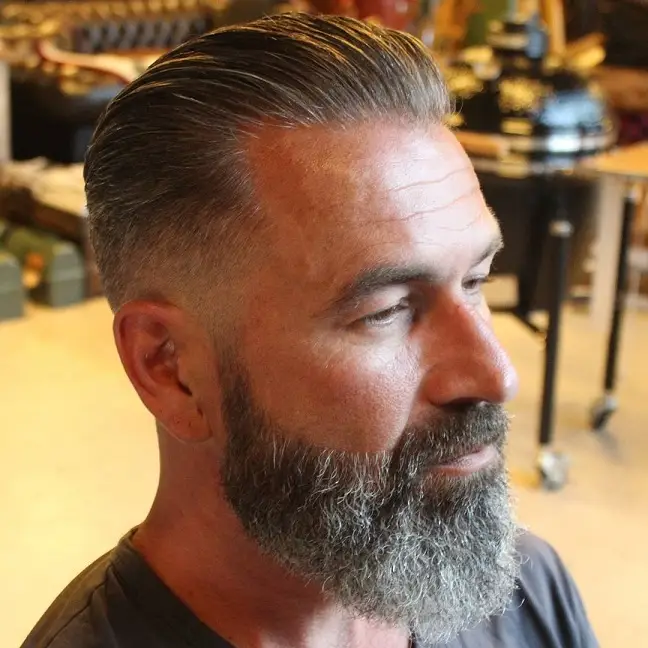 The Silver Slick Back with a Low Fade and Full Beard