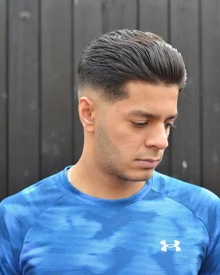 The Slick Back Pompadour with a Low Drop Fade