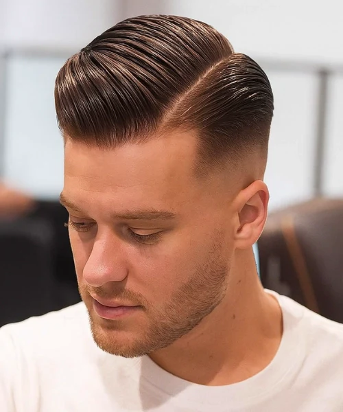 The Glossed Side Part Slick Back with a Mid Fade