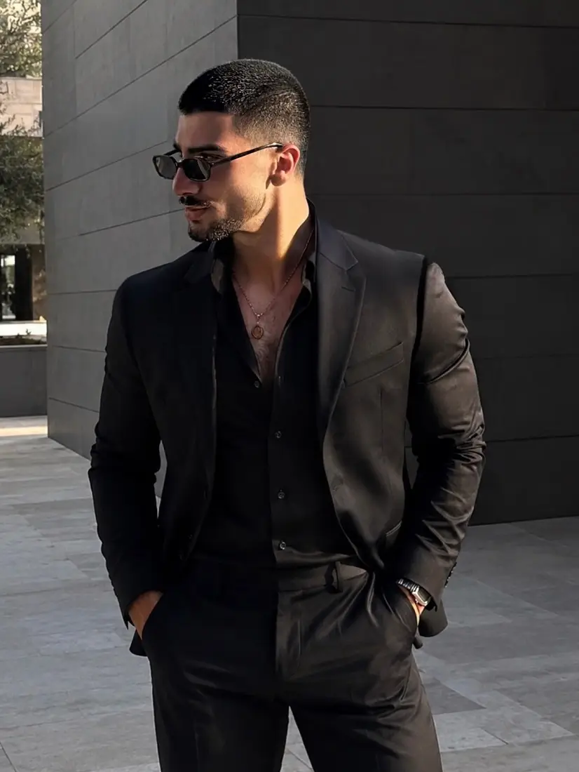 21 Stylish Black Outfit Ideas for Men That Look Effortlessly Cool 10 Black Blazer Over an Open Black Shirt
