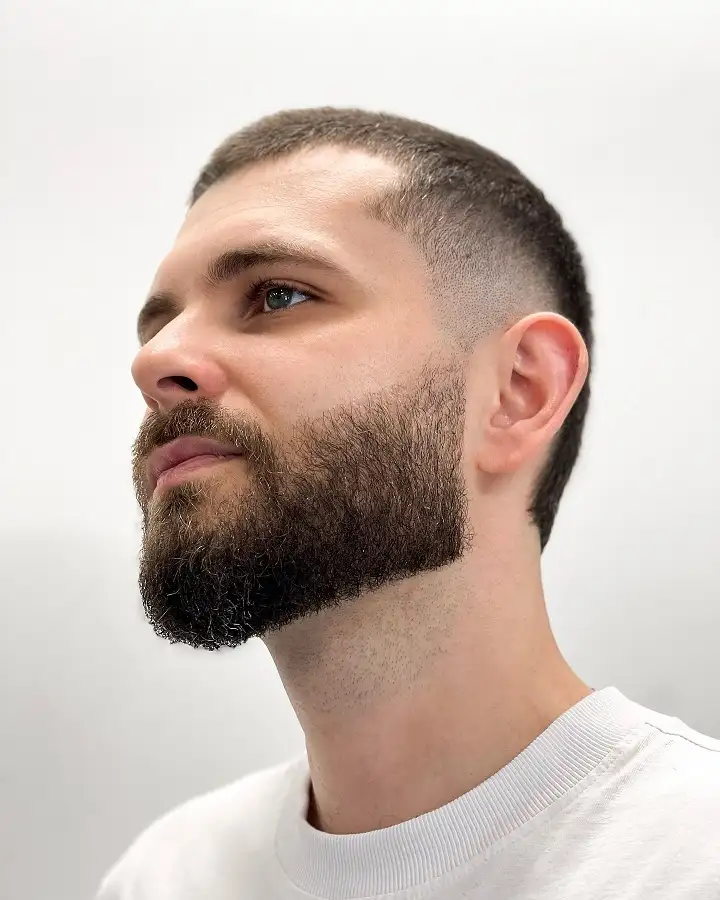 20 Trendy Buzzcut Hairstyles for Men for Every Face and Hairline 17 Textured Buzz With a Mid Fade