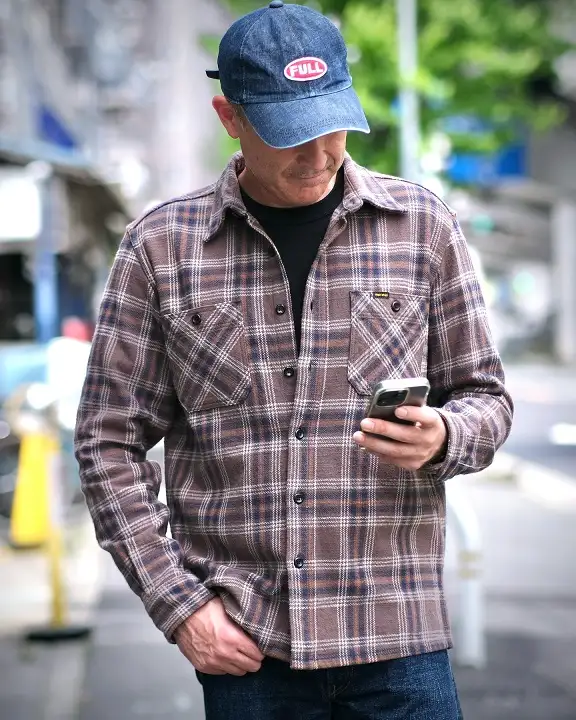 22 Men's Flannel Shirts Ideas for Fall You’ll Actually Wear 7 Brown Plaid Over a Black Mock Neck