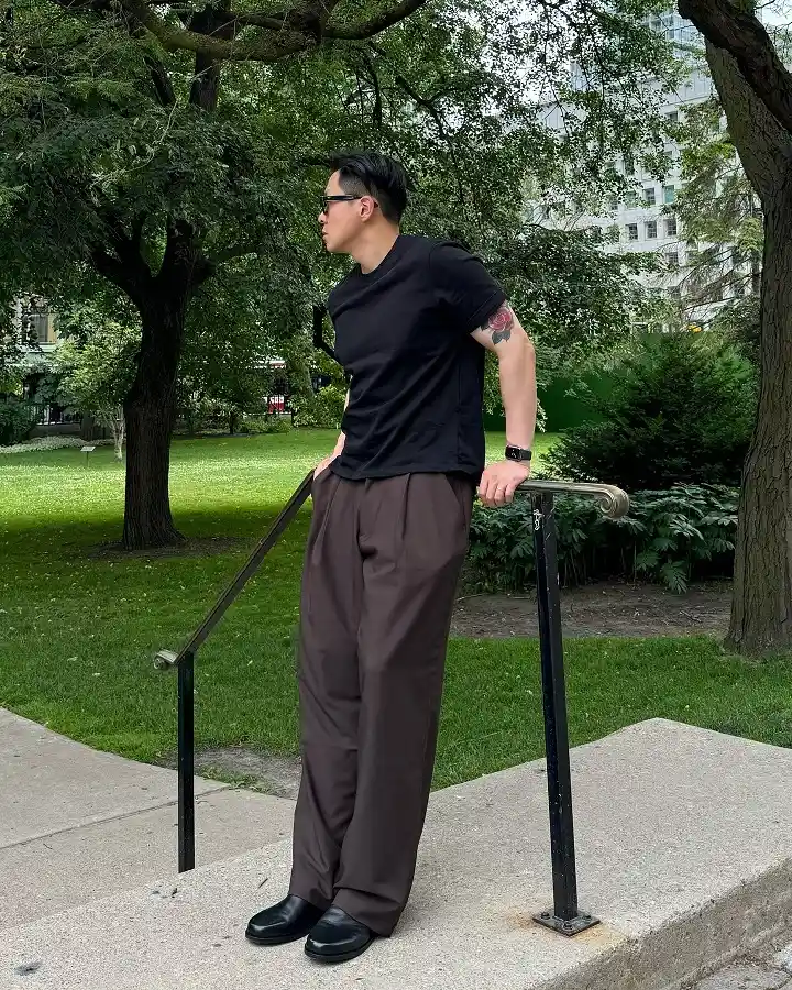 16 Wide Pants Outfit Ideas for Men That Actually Look Put Together 4 Chocolate Pleated Trousers That Look Sharp With Just a Black Tee
