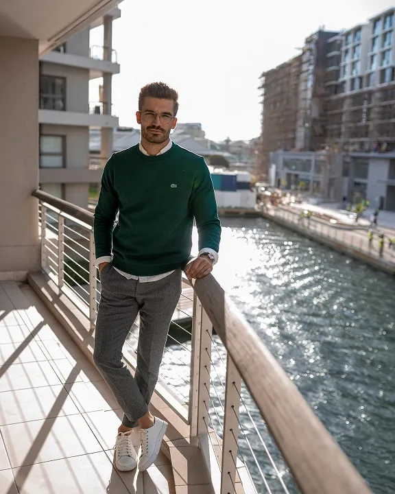 18 Men's Preppy Looks That Make Any Closet Look Expensive 6 Forest Green Sweatshirt Layered Over a Dress Shirt