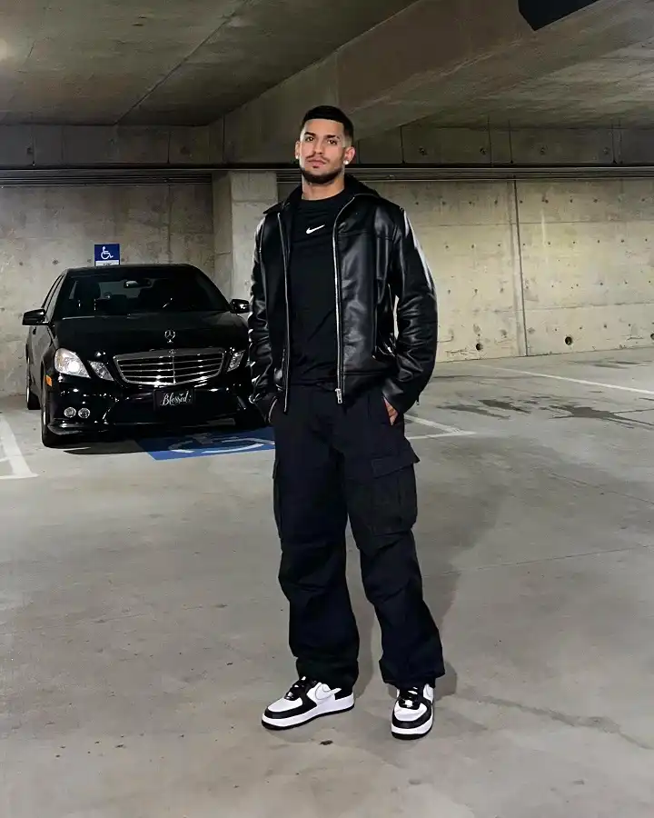 21 Stylish Black Outfit Ideas for Men That Look Effortlessly Cool 7 Black Leather Jacket, Cargos, and Panda Sneakers