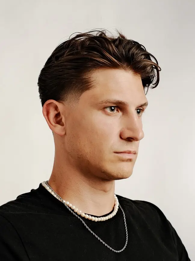 The Loose Wavy Slick Back with a Soft Taper