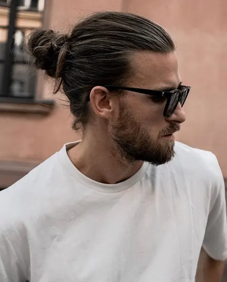 17 Bold Long Hairstyles for Men Worth Growing Your Hair For 4 Slicked Back Man Bun