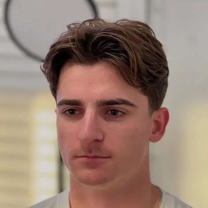 24 Timeless Old Money Haircuts for Men (With What to Ask Your Barber) 8 Ivy League Cut With a Natural Wave Left In