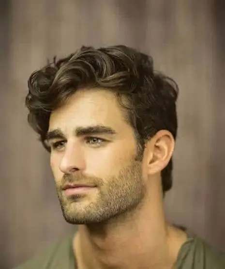 20 Wavy Hair Men Ideas That Look Natural and Stylish Now 16 The Side Swept Wave with Trimmed Sides