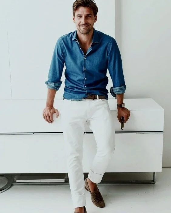 21 Stylish Denim Shirt Ideas for Men That Always Turn Heads 8 Tuck a Medium-Wash Chambray Into White Trousers for a Dressed-Up Contrast
