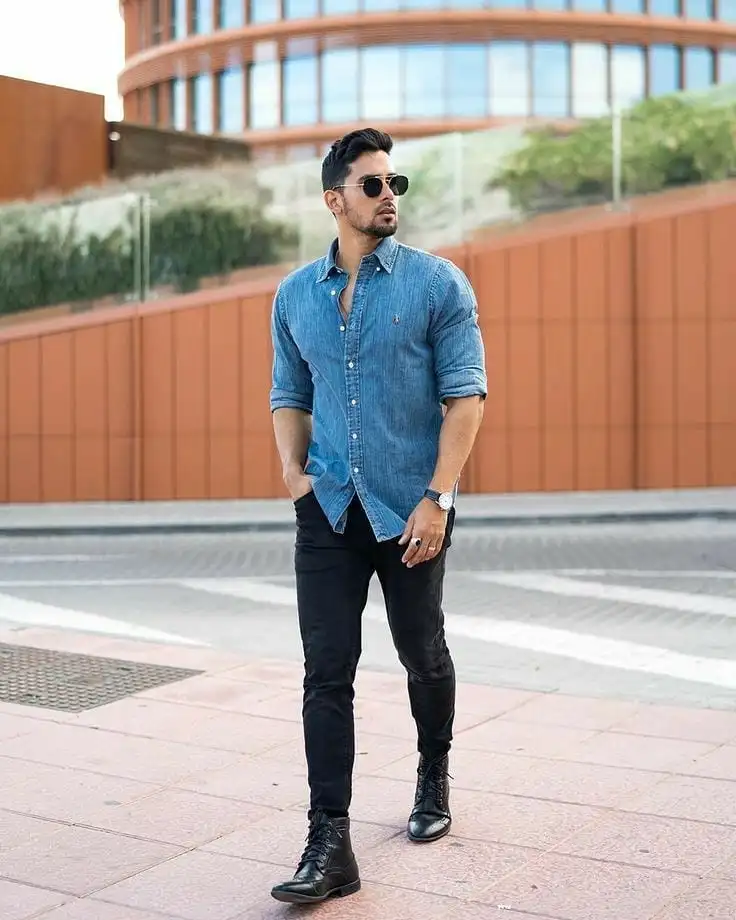 21 Stylish Denim Shirt Ideas for Men That Always Turn Heads 6 Blue-on-Black With a Boot That Anchors the Whole Look