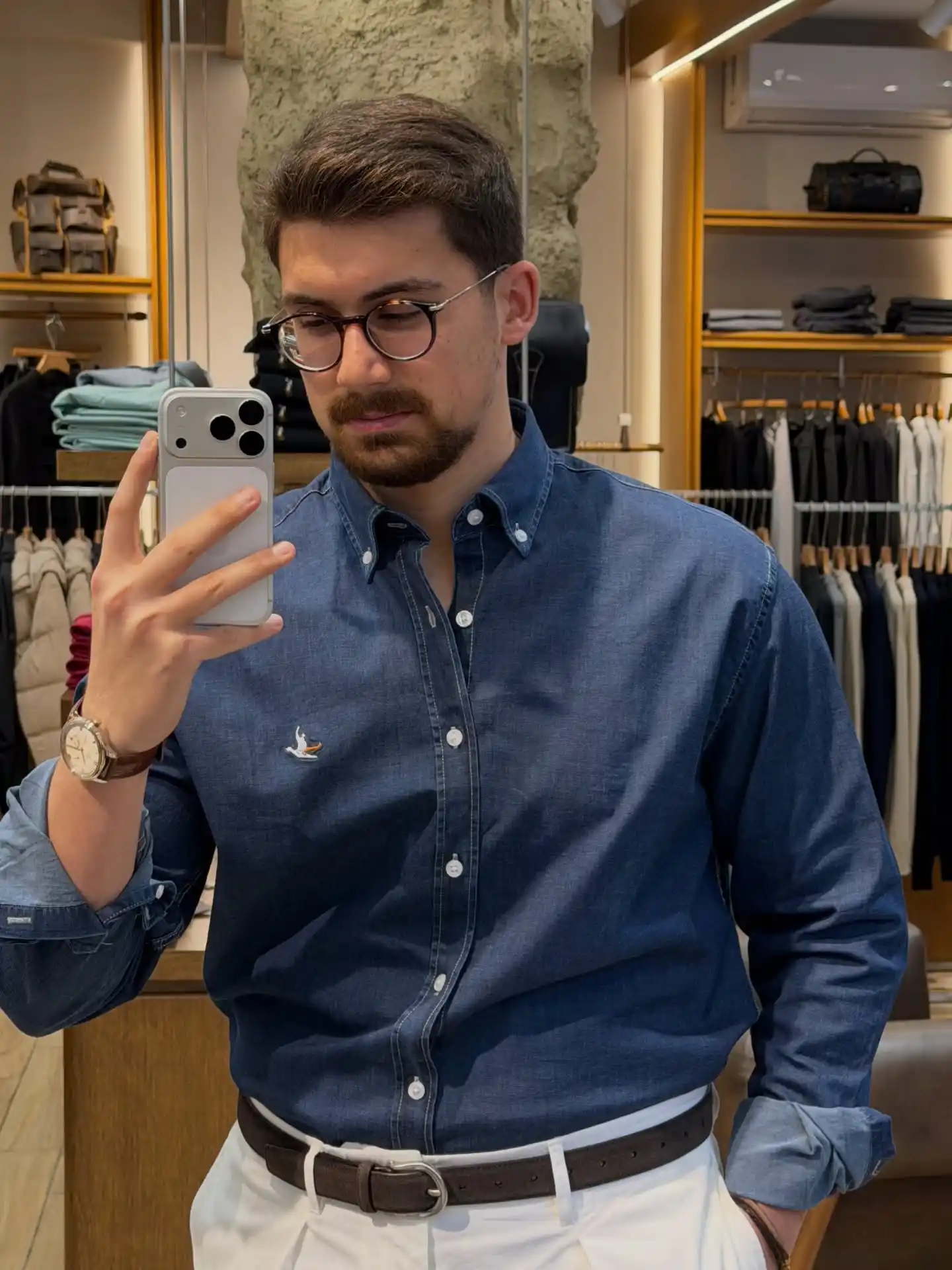 21 Stylish Denim Shirt Ideas for Men That Always Turn Heads 5 Tucked Chambray, White Trousers, and Matched Browns