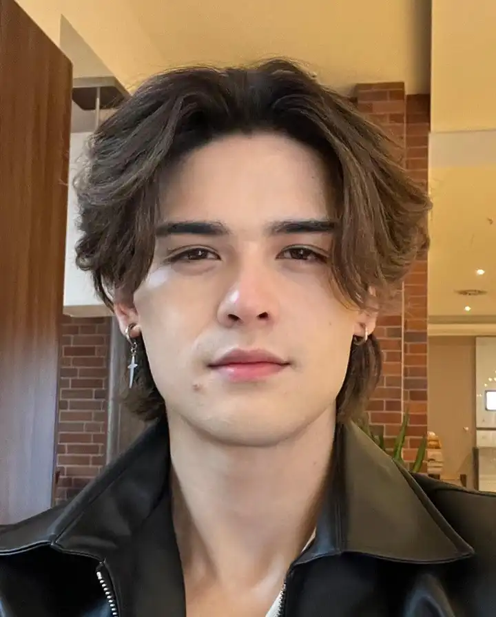 19 Wolfcut Hair for Men Styles Your Barber Will Actually Understand 2 Soft Middle Part Wolf Cut for a Low Effort Everyday Look