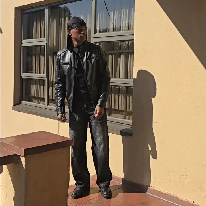 15 Bold Starboy Aesthetic Outfit Ideas for Men 10 All-Black Leather Moto Jacket and Wide Denim for Instant Edge