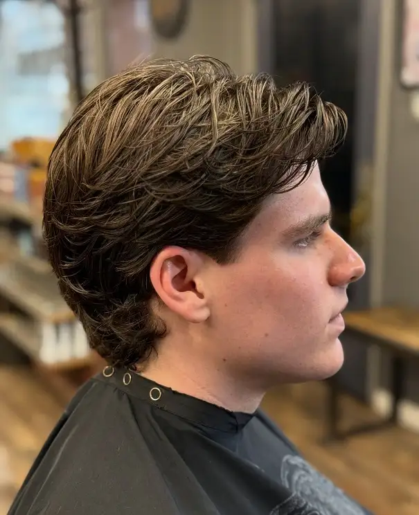 17 Classic Medium Length Mens Haircuts and Exactly What to Ask Your Barber 6 Wavy Push Back With Length Left on the Neck