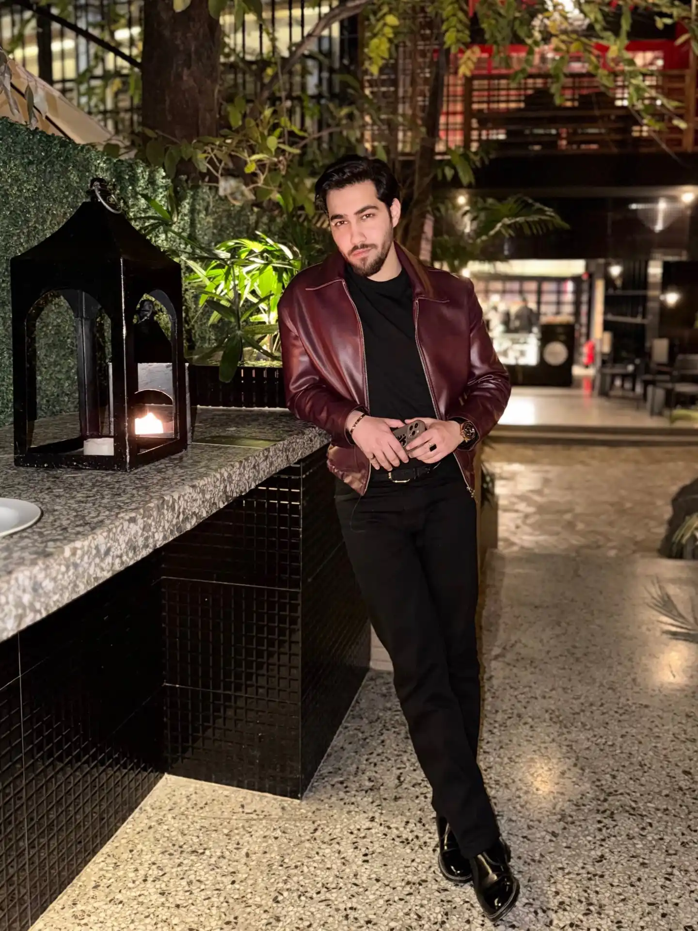4. Burgundy Leather Jacket with Black Trousers