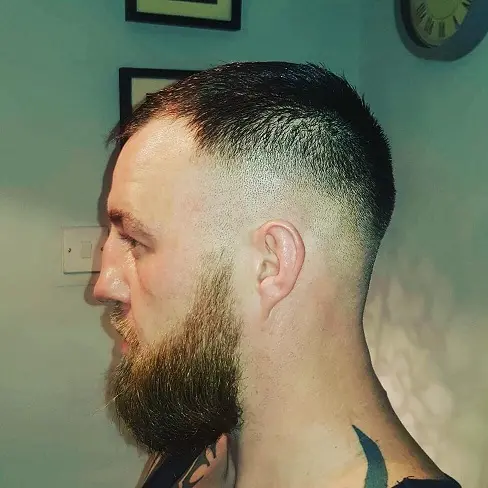 22 Warrior Haircut Ideas for Men: Braids, Fades, and Full Beards 18 Buzzed Top With a Sharp Line Up
