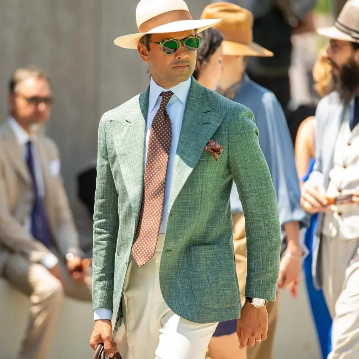 Textured Green Jacket With Cream Trousers and a Panama