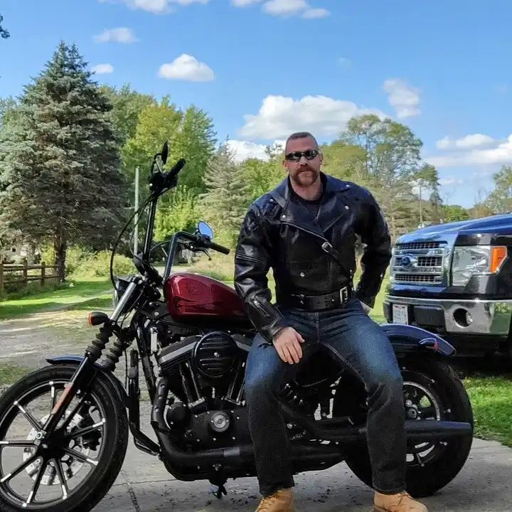 Classic Biker Jacket With Mid Blue Jeans and Work Boots