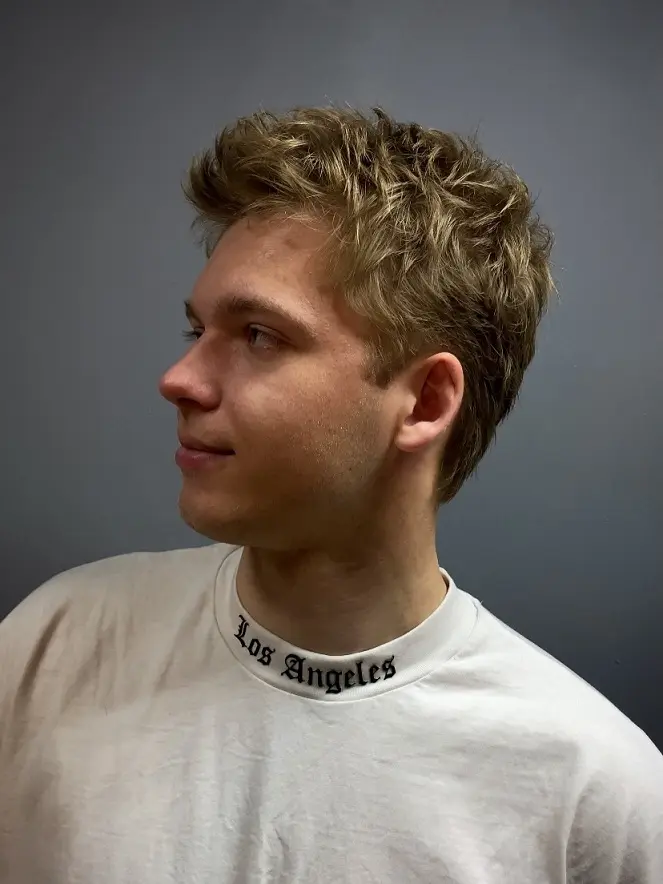 22 Warrior Haircut Ideas for Men: Braids, Fades, and Full Beards 16 Loose Blond Waves With Soft Sides