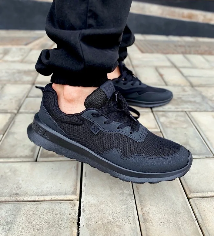Blacked-Out Runner With Black Sweatpants