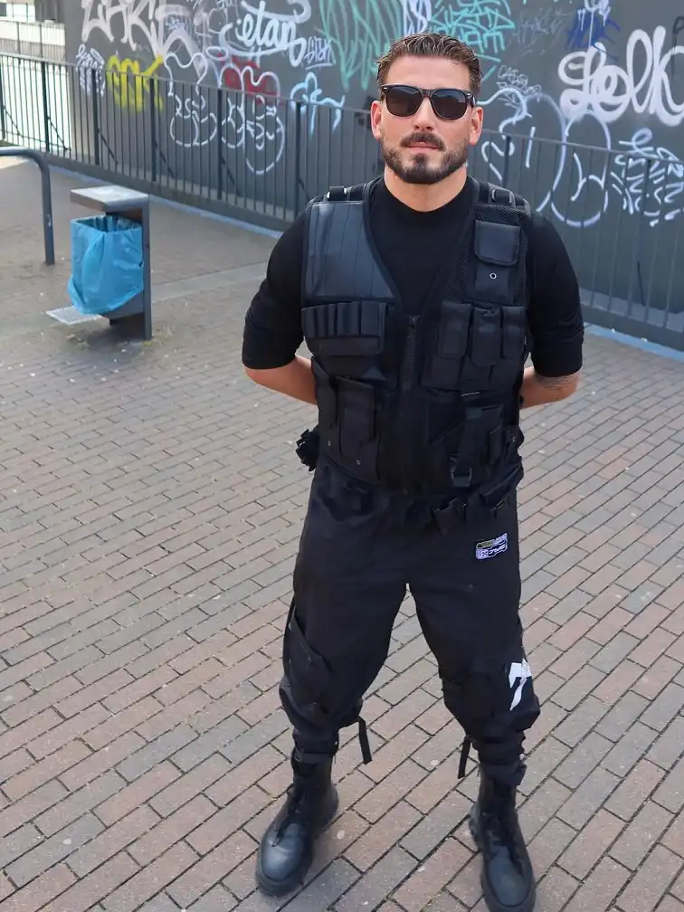 25 Rave Outfits for Men That Go All-in on Style 4 Tactical Vest Over a Fitted Base Layer for a Rave-Ready Uniform