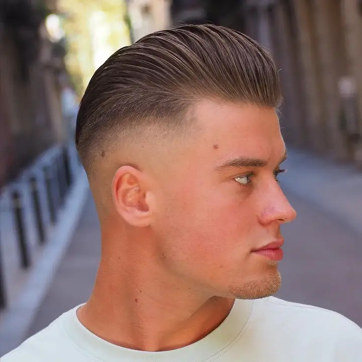 20 Pompadour Hairstyles for Men, From Skin Fades to Soft Tapers 16 Mid Fade Slick Back Pompadour