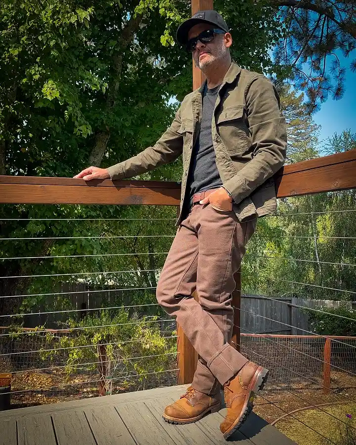 Brown Duck Pants Cuffed Over Tall Lug Sole Boots