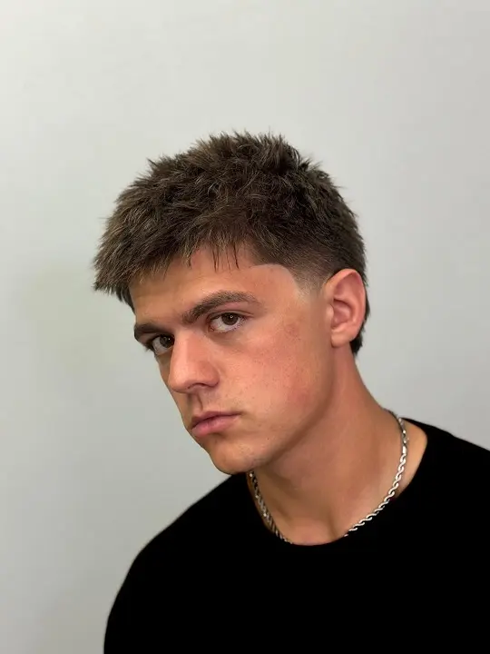 22 Warrior Haircut Ideas for Men: Braids, Fades, and Full Beards 19 Short Spiky Crop With a Straight Fringe
