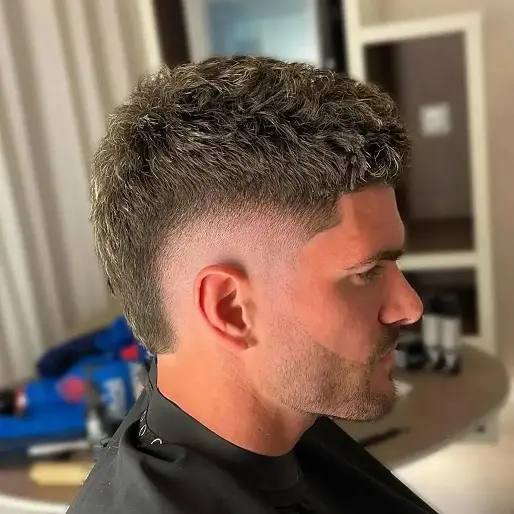22 Warrior Haircut Ideas for Men: Braids, Fades, and Full Beards 15 Tight Curls With a Blunt Cut Fringe