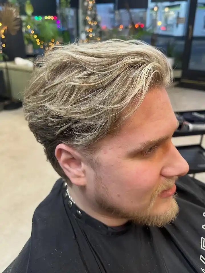 15 Cool Blonde Hair Ideas for Men That Look Fresh, Not Bleached 12 Blonde Highlights Ribboned Through Thick Waves