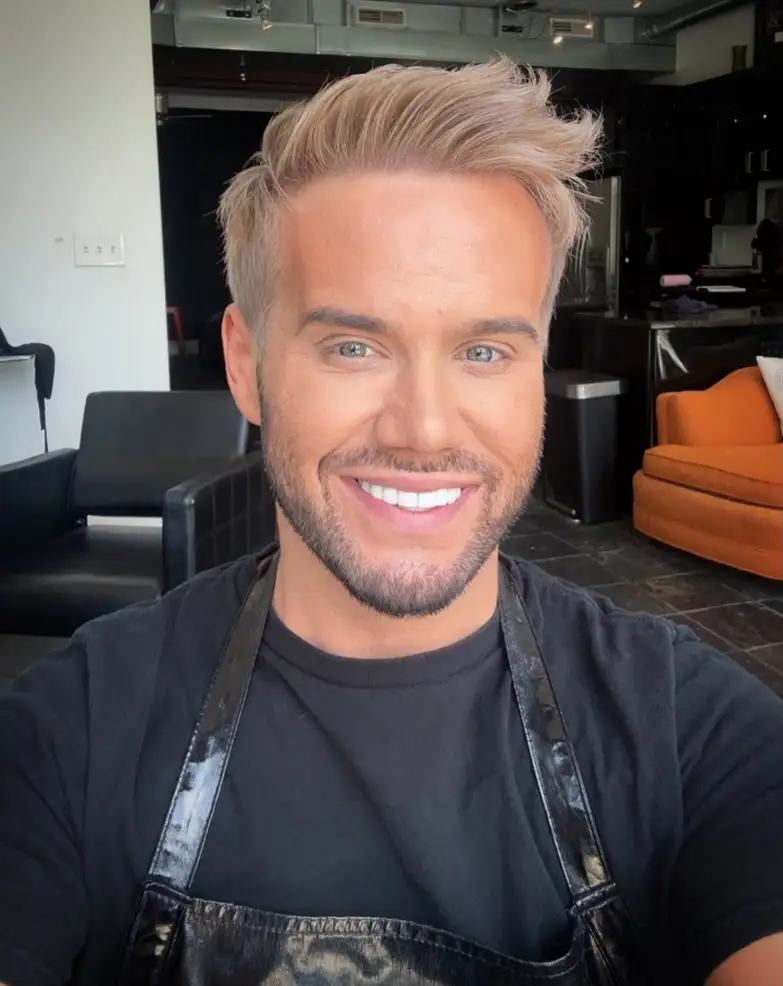 Glossy Ash Blond Swept Back for a Polished Finish