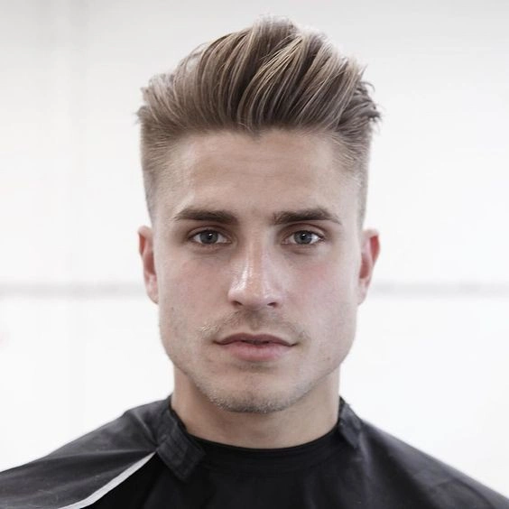 23 Sharp Gentleman Haircuts That Never Go Out of Style 2 Textured Pompadour With a Soft Taper