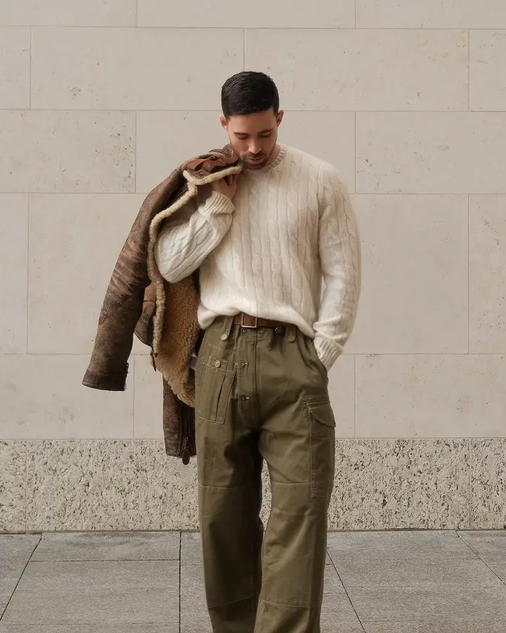 20 Cable Knit Sweater Outfits For Men That Look Expensive 7 Cream Cable Knit With Olive Utility Trousers