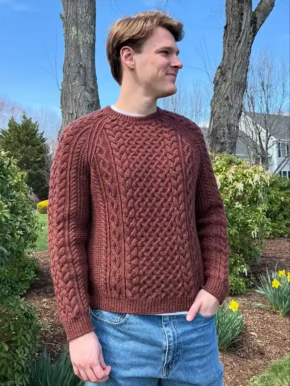 20 Cable Knit Sweater Outfits For Men That Look Expensive 3 Rust Aran Knit With Light Wash Jeans