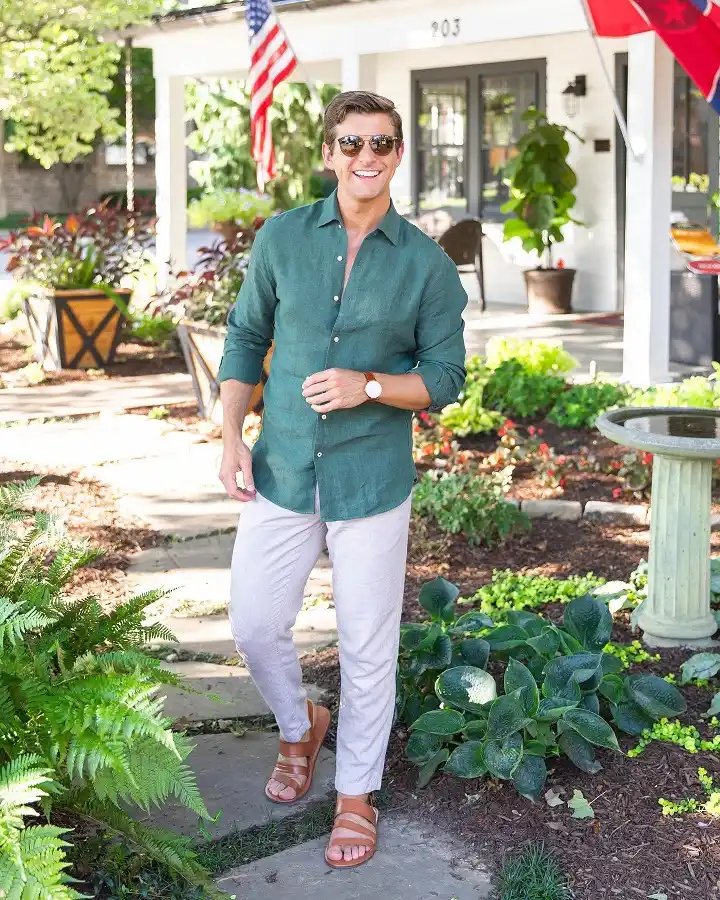 A Deep Green Linen Shirt Pairs With Pale Stone Trousers for a Front Porch Look
