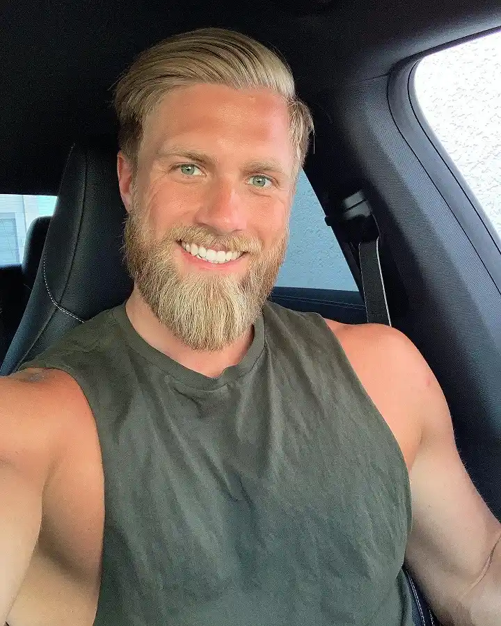 Slicked-Back Blond Fade With a Beard to Match
