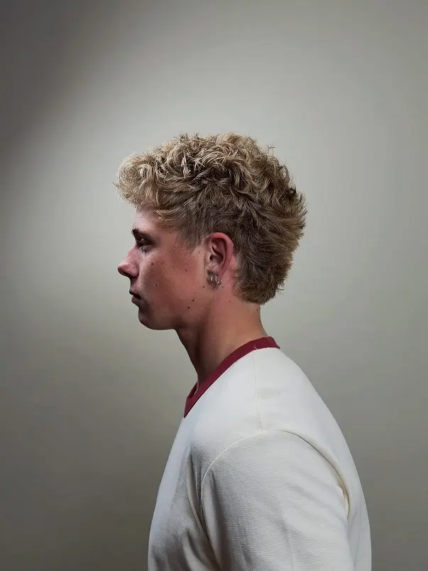 22 Warrior Haircut Ideas for Men: Braids, Fades, and Full Beards 21 Bleached Curls With a Clean Taper