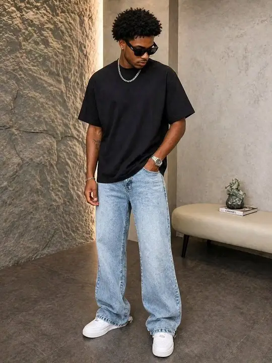 21 Men's T-Shirt Outfit Ideas That Actually Look Put Together 3 Plain Black Tee With Baggy Light Wash Jeans