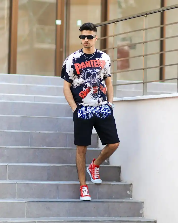 22 Black Shorts Outfit Ideas for Men That Actually Look Put Together 6 Loud Graphic Tee, Grounded by Plain Black Shorts