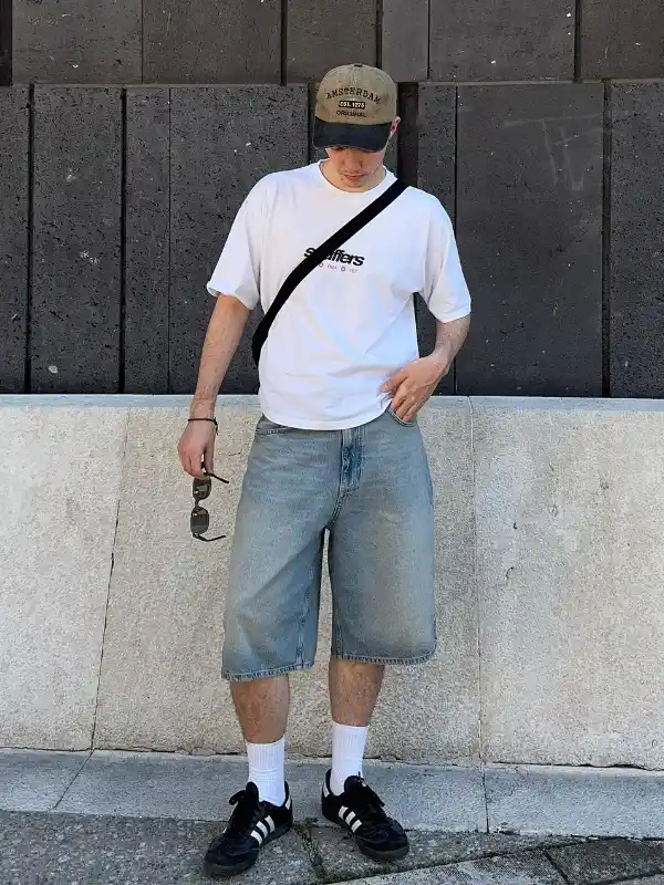 3. Baggy Denim Shorts With a Trucker Cap for a Skate Inspired Outfit