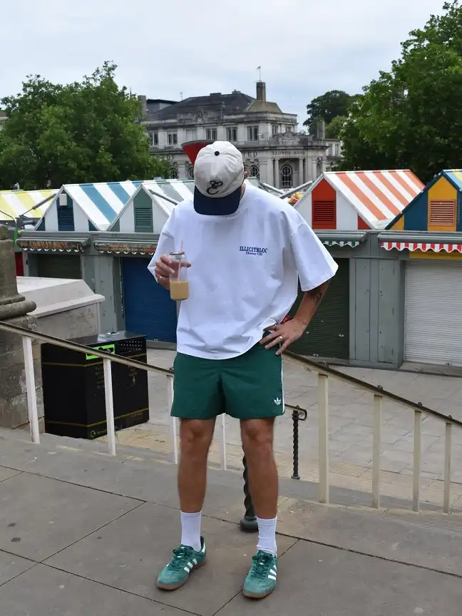 White Boxy Tee With Green Shorts and Sneakers to Match