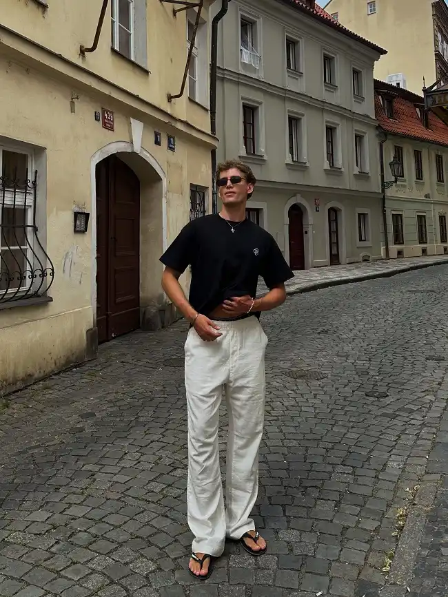 Summer Fashion for Skinny Guys: 20 Looks That Add Shape and Height 19 Black Tee and White Linen Trousers