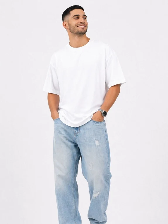 21 Men's T-Shirt Outfit Ideas That Actually Look Put Together 8 White Tee, Straight Light Jeans, Nothing Else