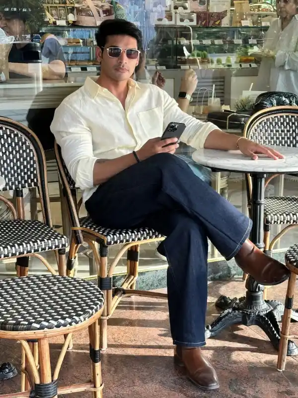 22 Coffee Date Outfits for Men That Make a Great First Impression 13 10. The Cream Shirt and Wide Leg Denim Combo That Feels Effortless On Camera